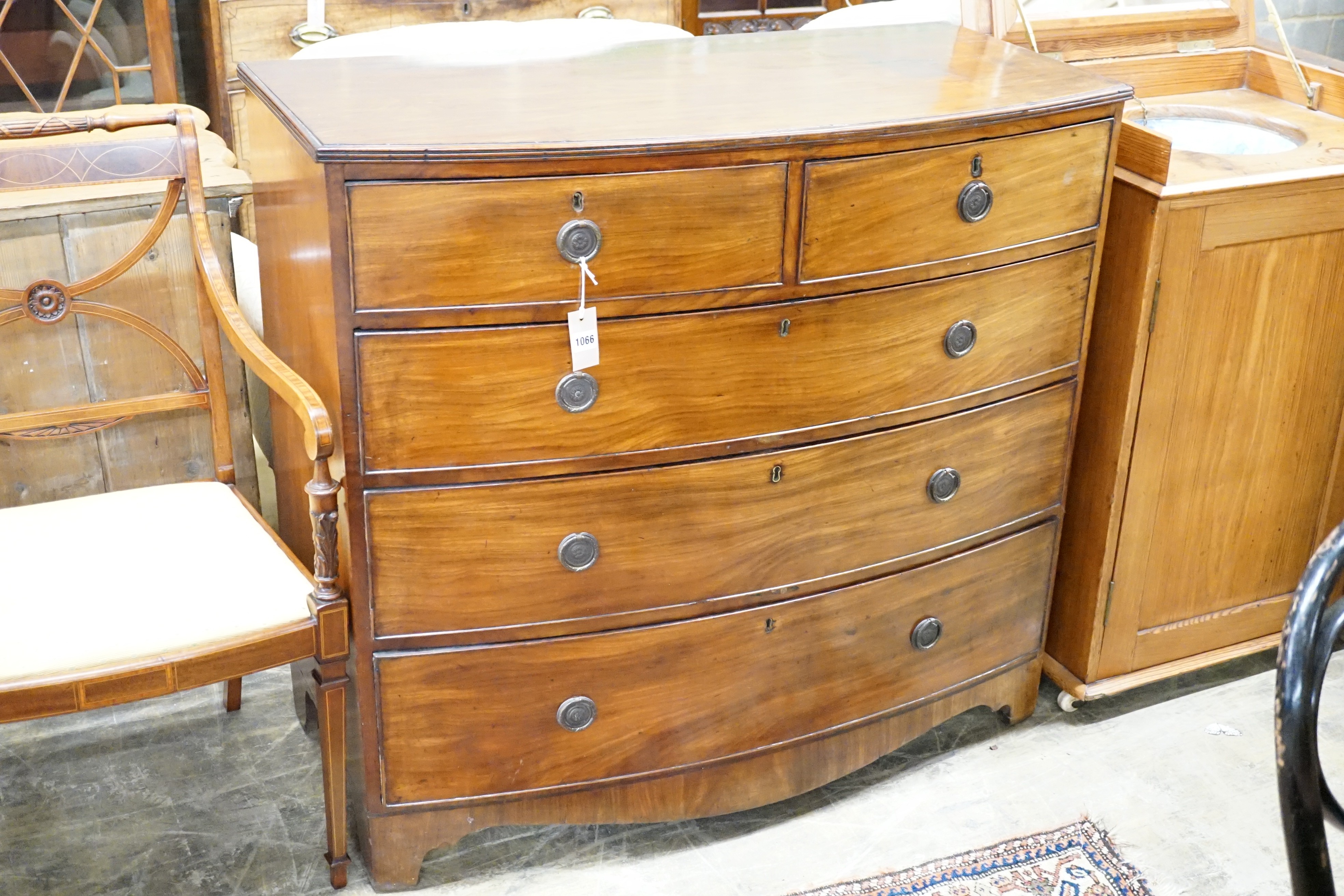 A Regency bow fronted mahogany chest of two short and three long drawers, width 108cm, height 100cm